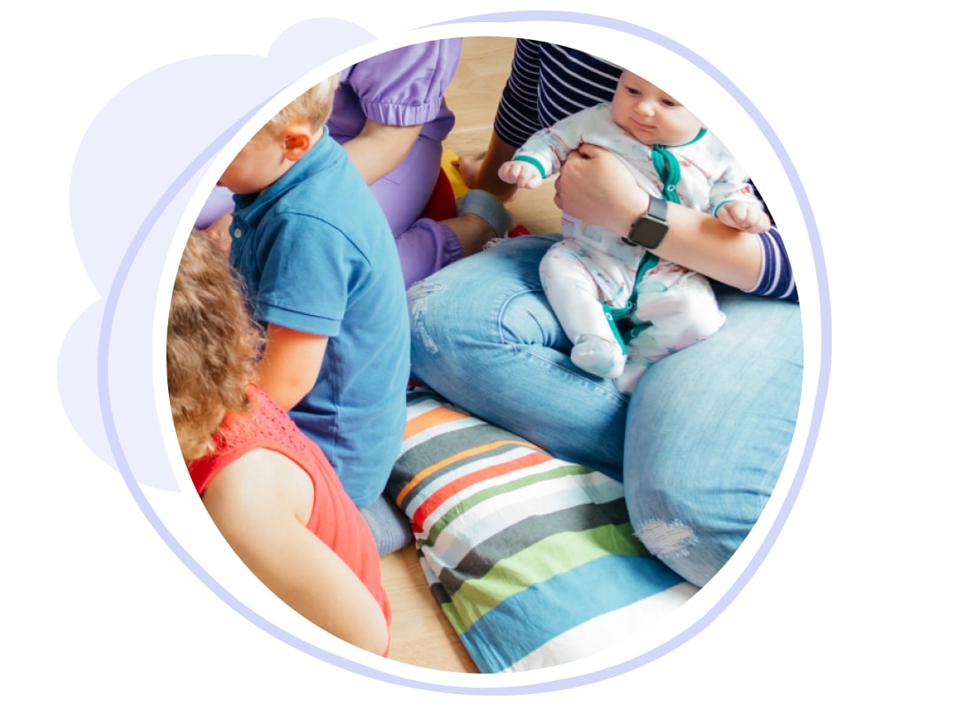 Childminder and children in soft cushion area